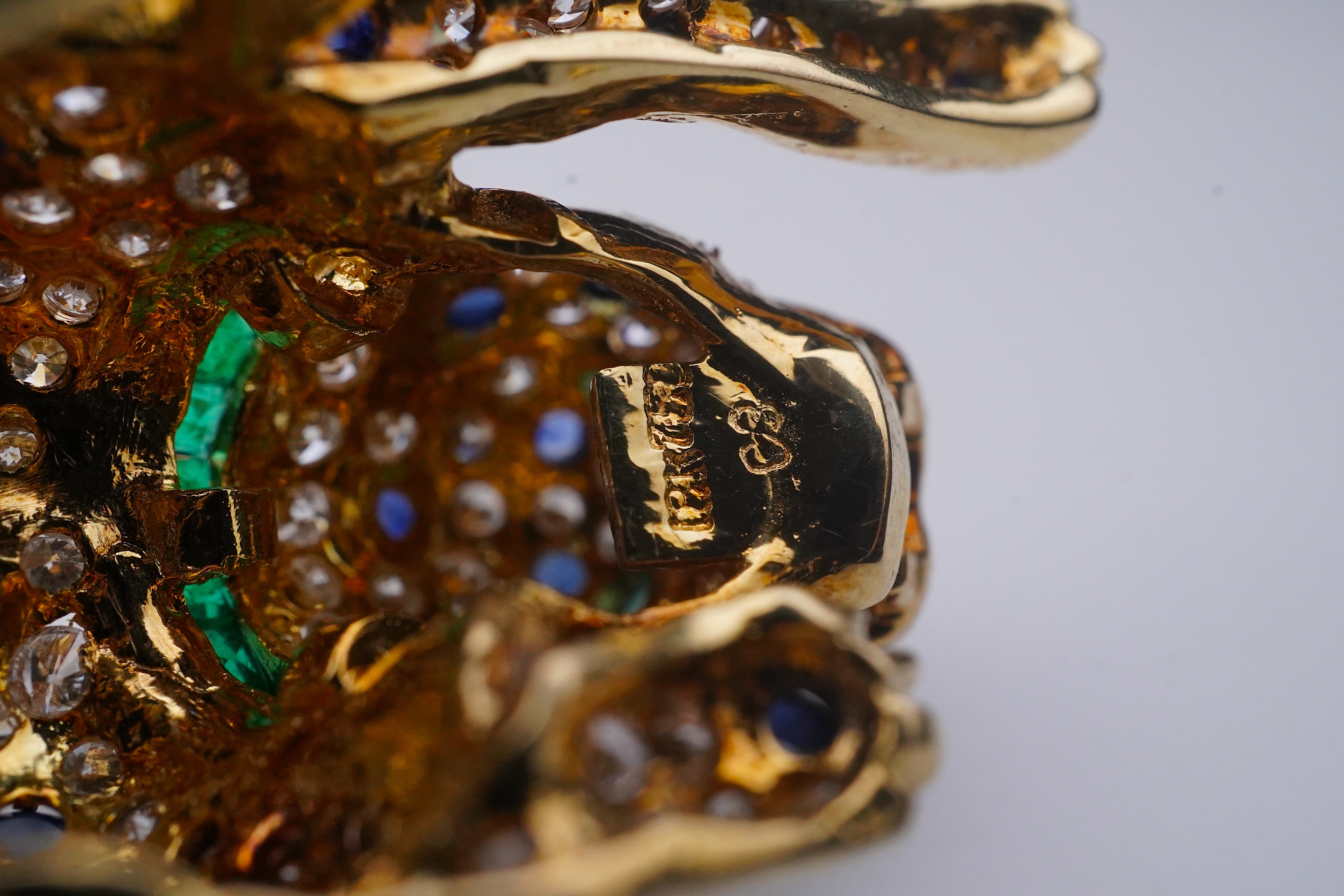 A sapphire, emerald and diamond brooch